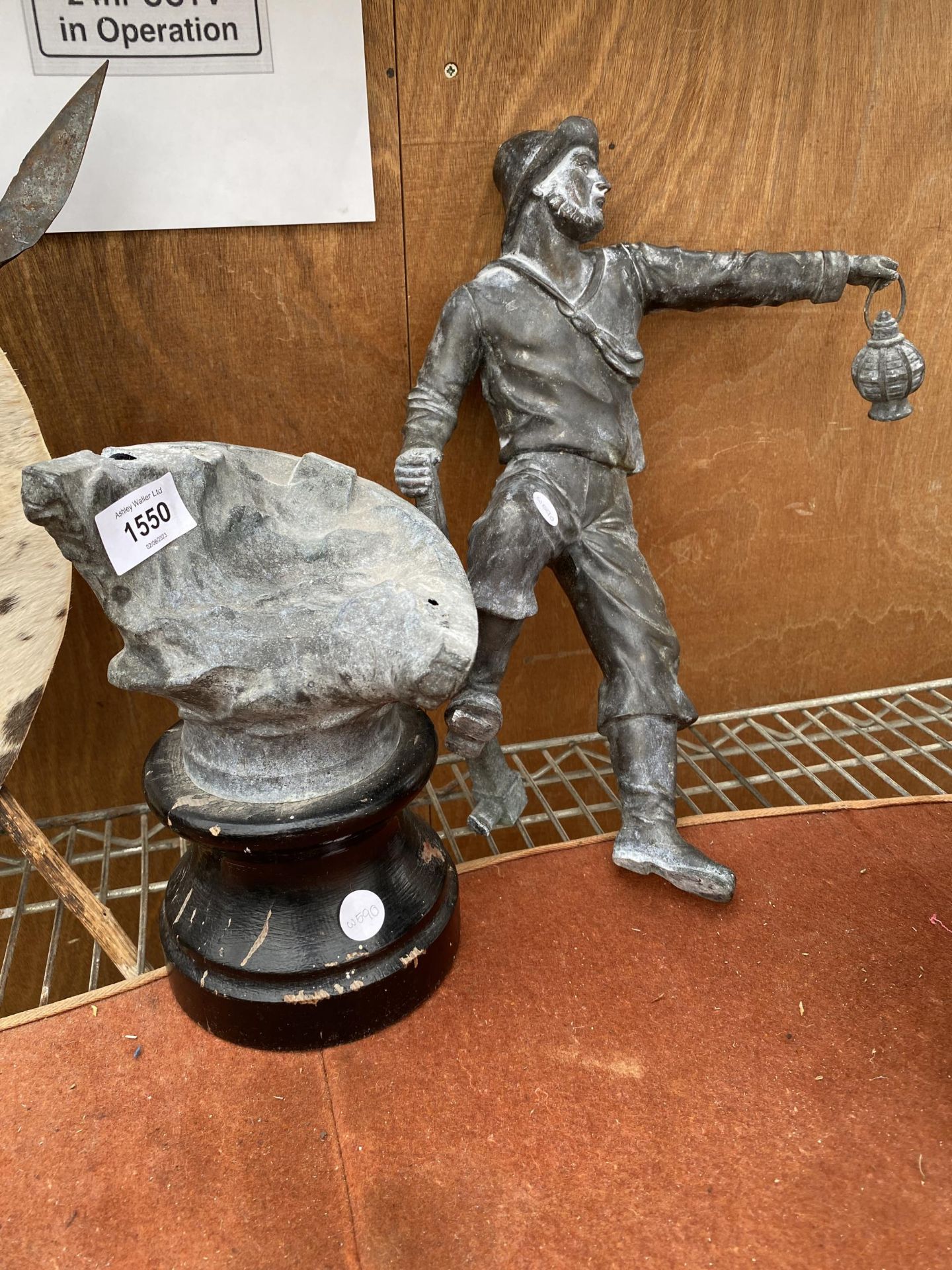 A VINTAGE METAL STATUE OF A MINER (A/F)