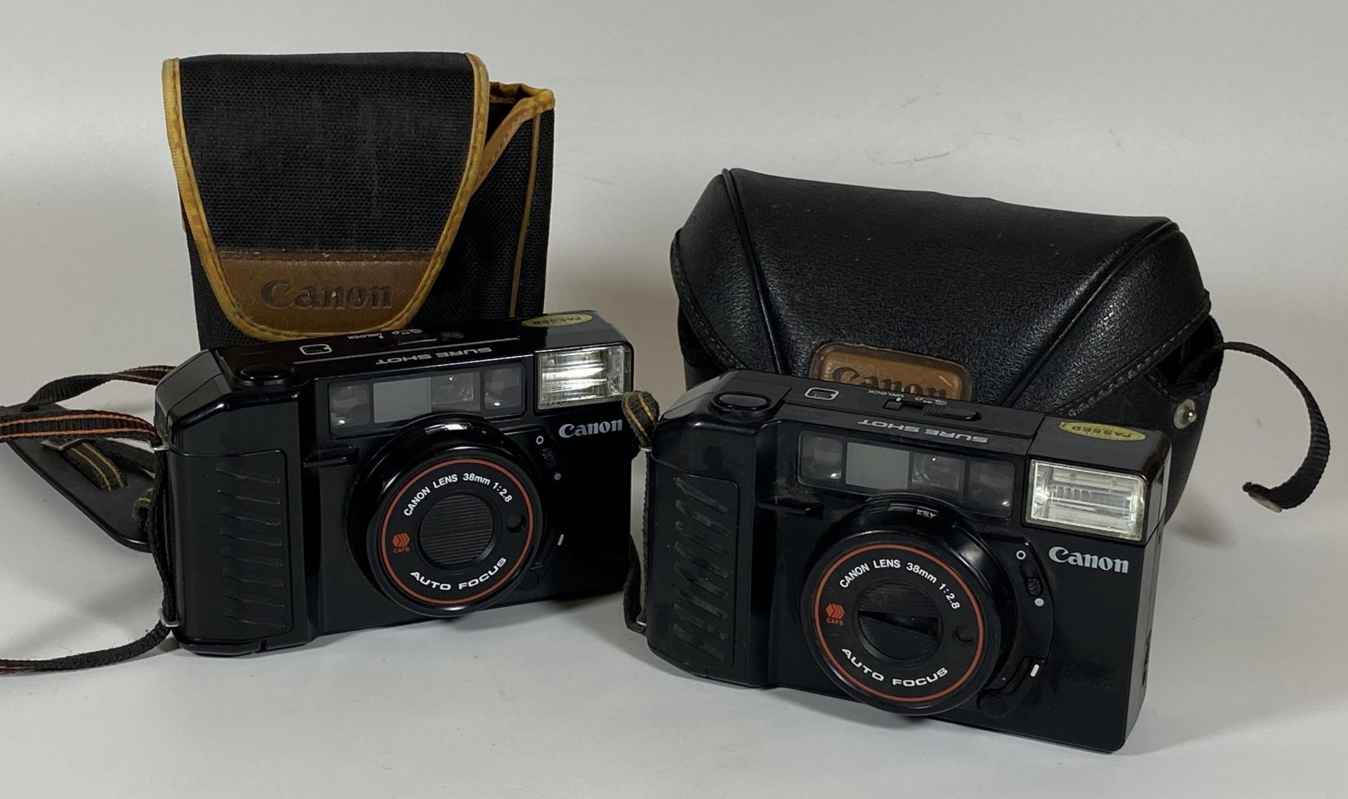 TWO CASED CANON SURE SHOT 38MM CAMERAS