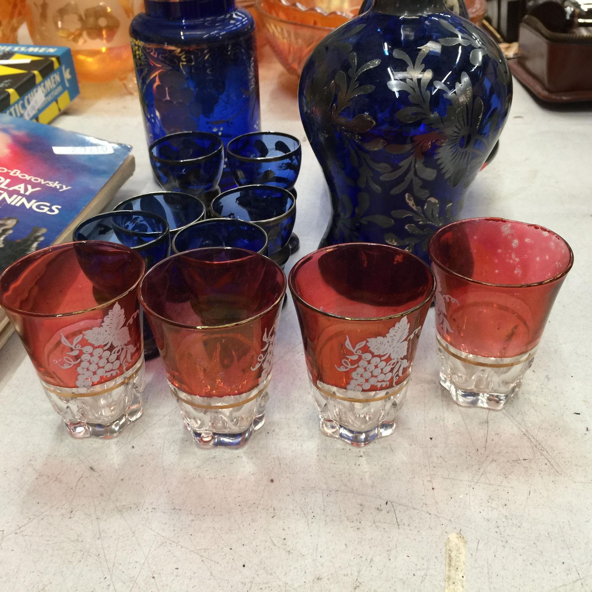 A VINTAGE BLUE GLASS WITH GILT DECORATION DECANTER, STORAGE JAR, VASE AND GLASSES PLUS FOUR - Image 2 of 4