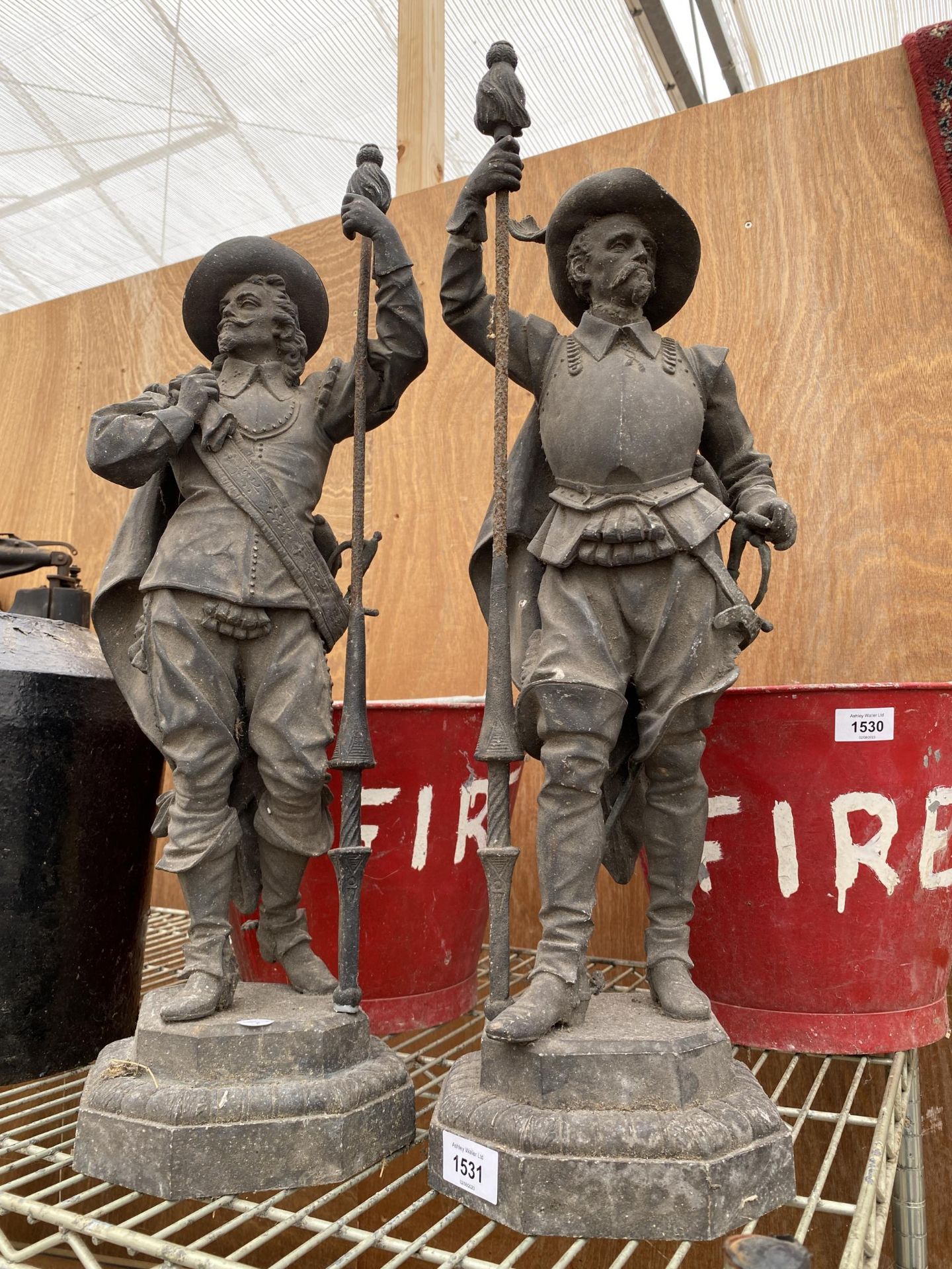 A PAIR OF VINTAGE METAL CAVALIER STATUES