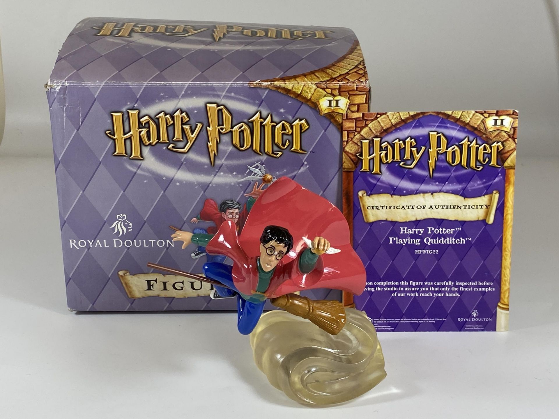 A BOXED ROYAL DOULTON HARRY POTTER PLAYING QUIDDITCH HPFIG22 FIGURE WITH CERTIFICATE