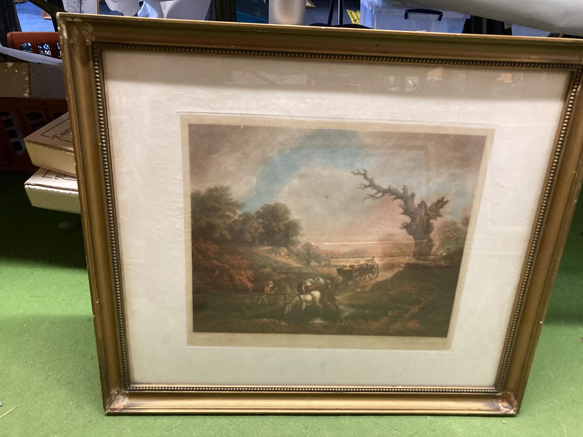 A GILT FRAMED ENGRAVING OF A HORSE AND CART SCENE