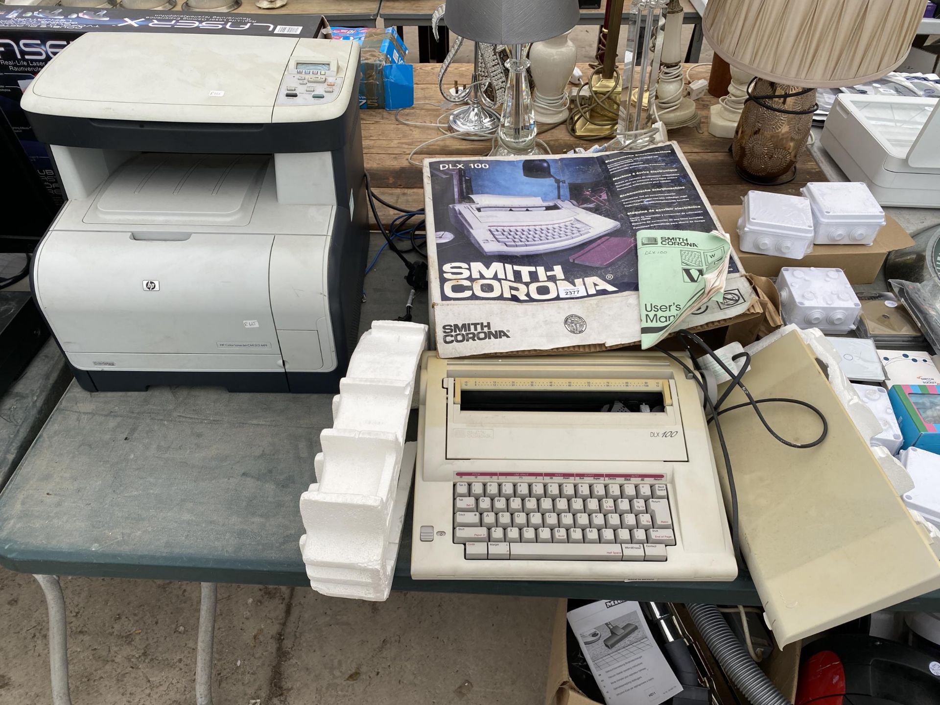 A SMITH CORONA TYPEWRITER AND A HP PRINTER