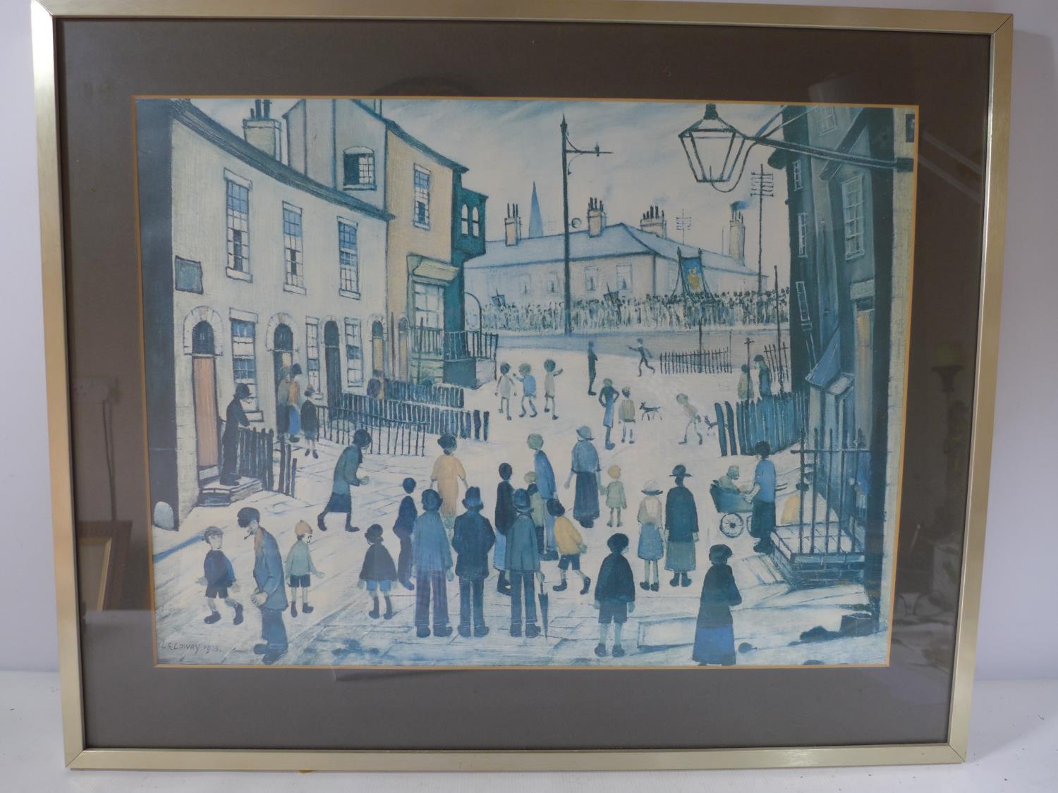 L.S.LOWRY, 'STREET PARADE', COLOURED PRINT, 45X60CM, FRAMED AND GLAZED