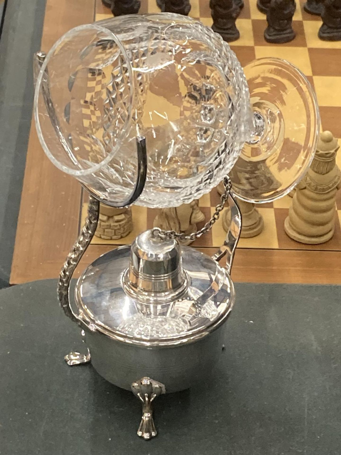 A WHITE METAL BRANDY GLASS WARMER AND A WATERFORD CRYSTAL BRANDY GLASS