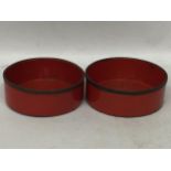A PAIR OF GEORGIAN RED LACQUERED WINE COASTERS