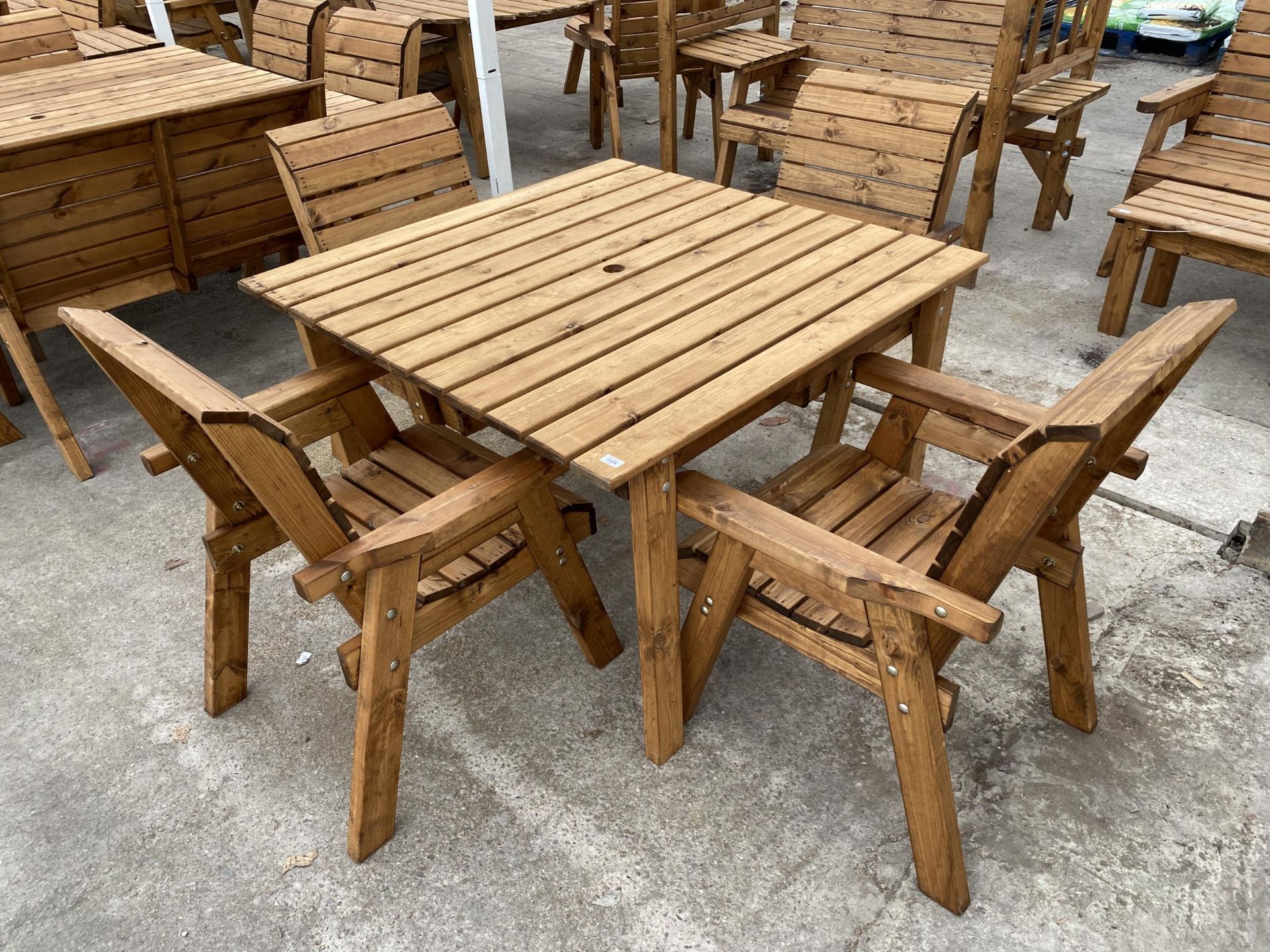 AN AS NEW EX DISPLAY CHARLES TAYLOR PATIO FURNITURE SET COMPRISING OF A SQUARE TABLE AND FOUR CHAIRS