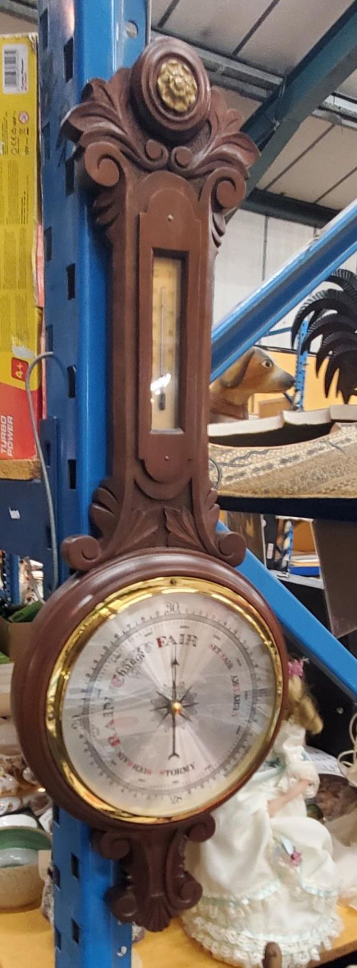 A VINTAGE MAHOGANY CASED BAROMETER AND THERMOMETER