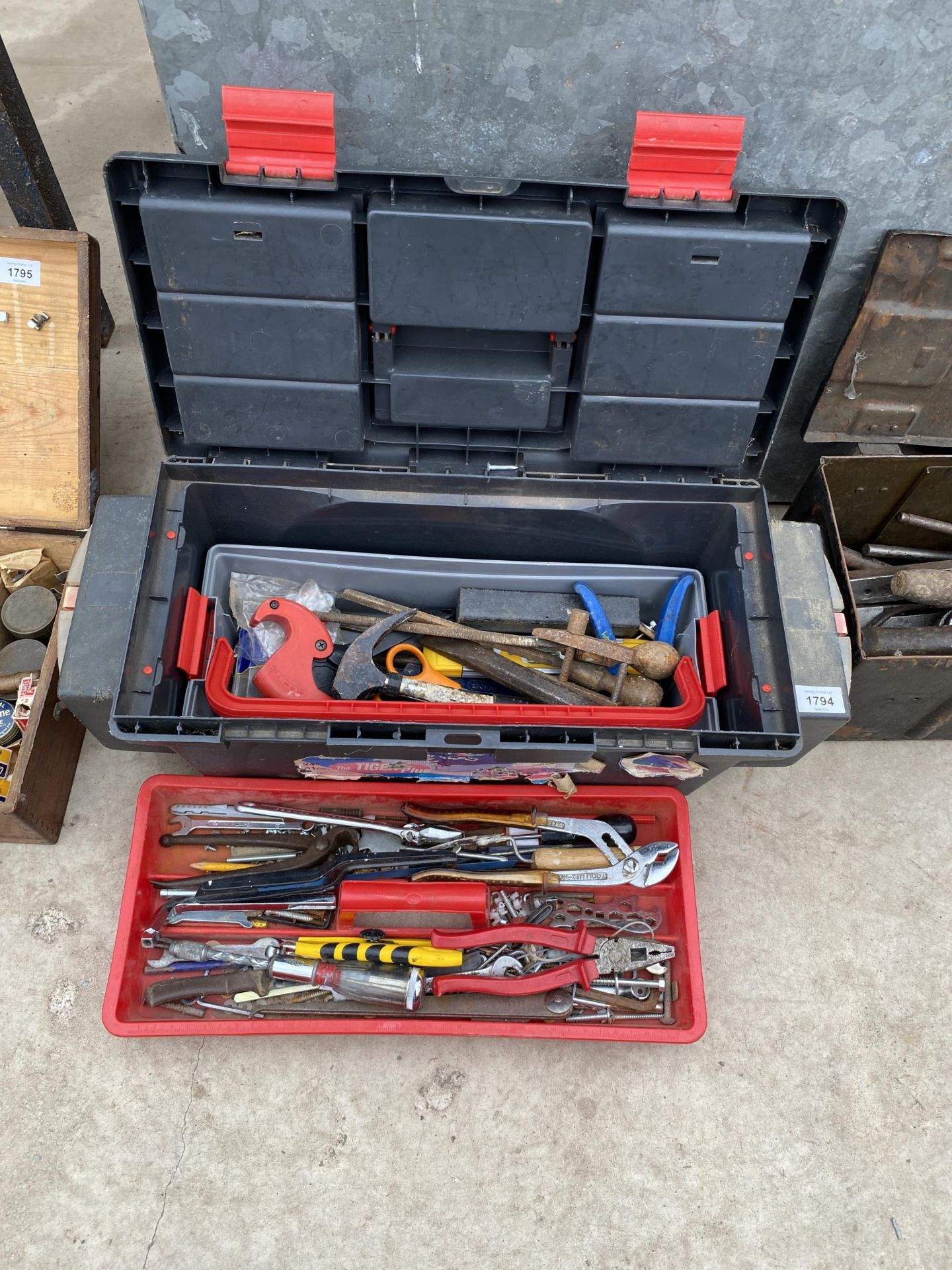 A PLASTIC TOOL BOX WITH AN ASSORTMENT OF TOOLS TO INCLUDE A HAMMER, PLIERS AND FILES ETC