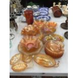 A LARGE QUANTITY OF AMBER AND CARNIVAL GLASS TO INCLUDE VASES, BOWLS, ETC