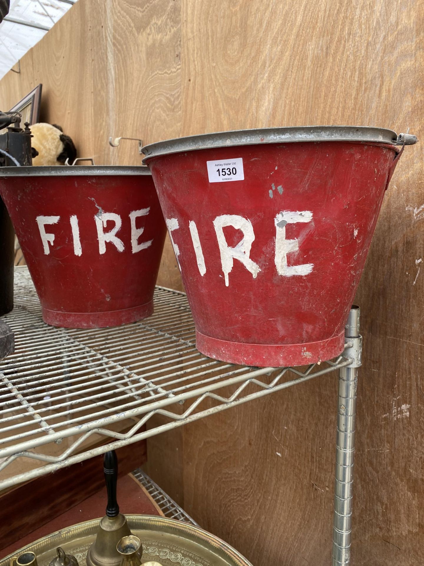 A PAIR OF RED PAINTED FIRE BUCKETS