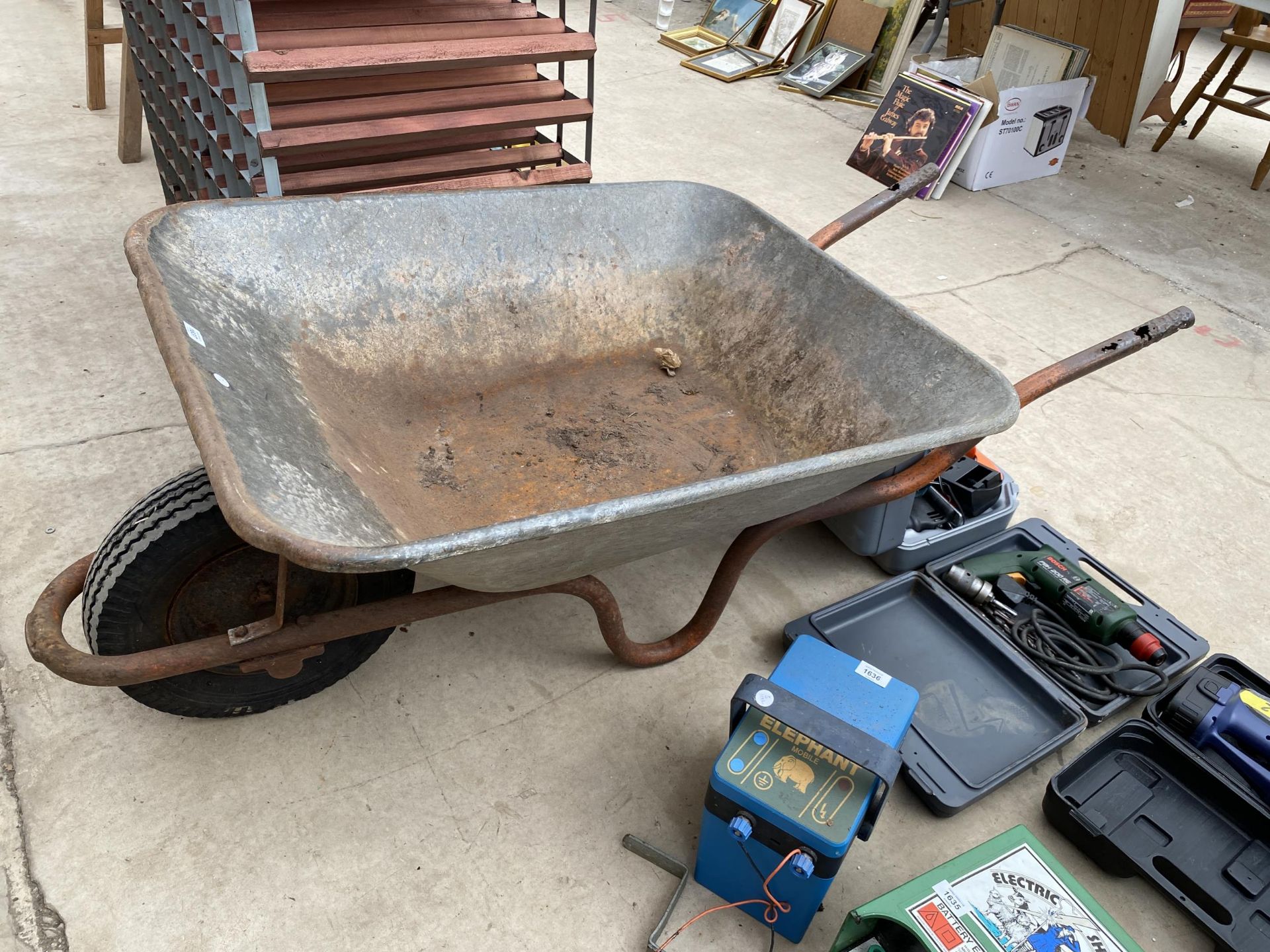 A LARGE HEAVY DUTY METAL WHEEL BARROW