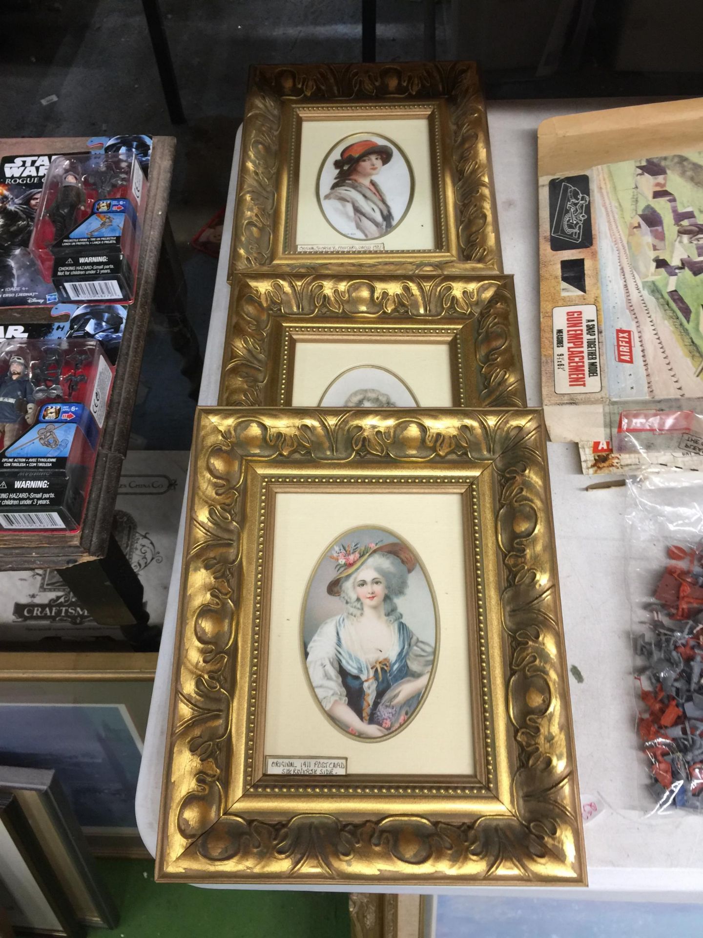 THREE EDWARDIAN POSTCARD PORTRAITS IN GILT FRAMES