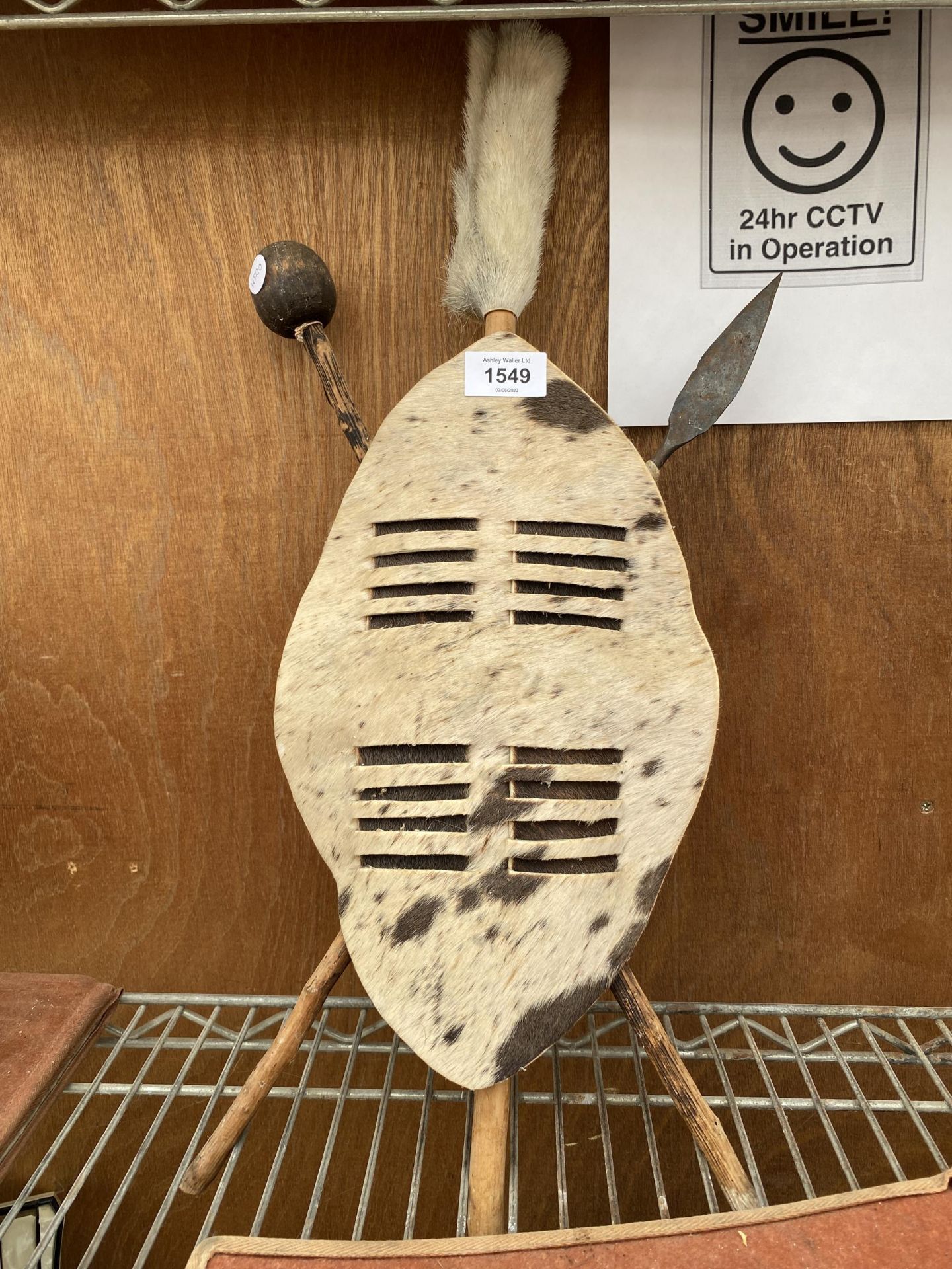 A TRIBAL SHIELD AND SPEARS PLAQUE