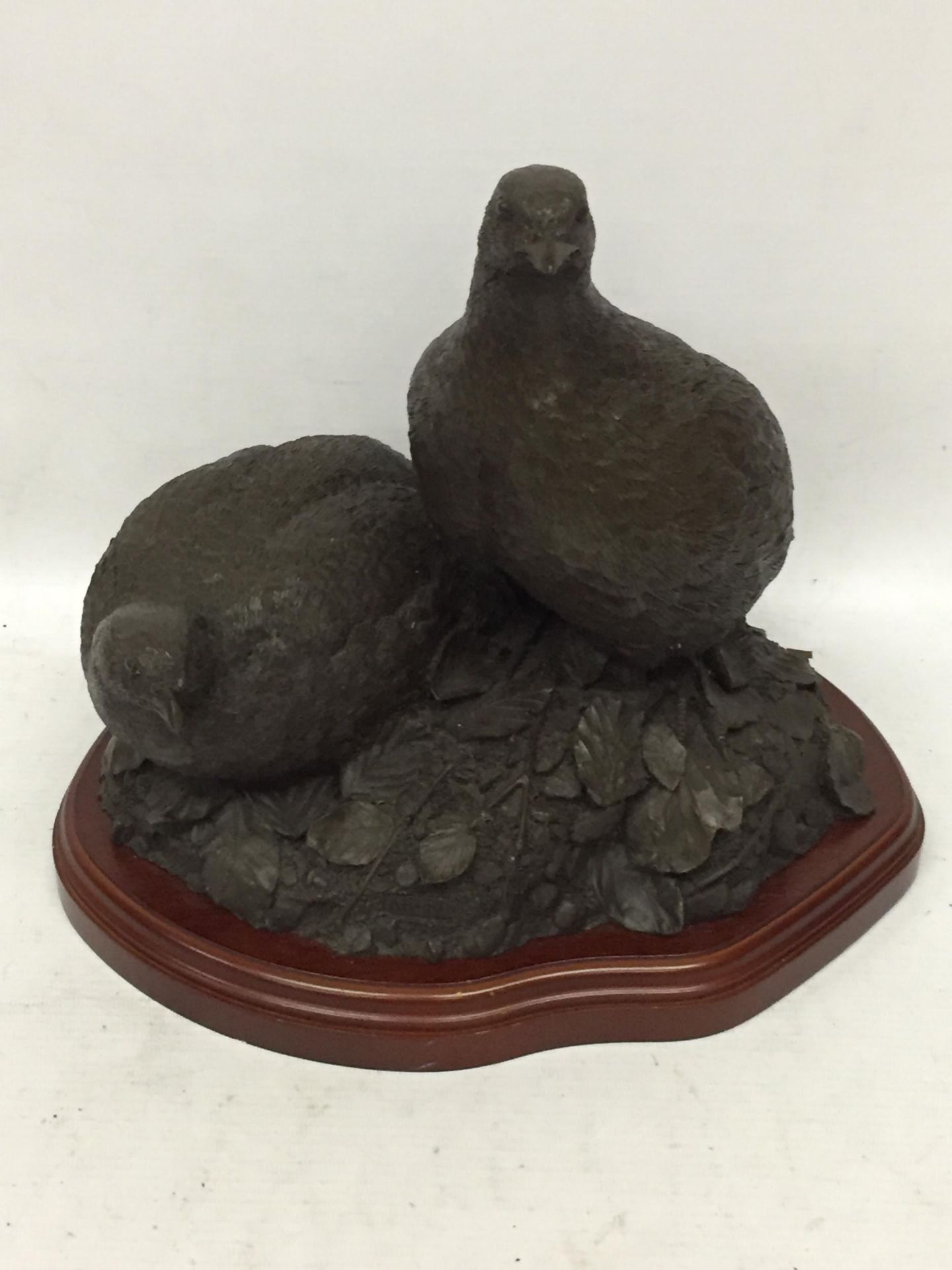 A RESIN FIGURE OF TWO PARTRIDGES BY A.HAYMAN
