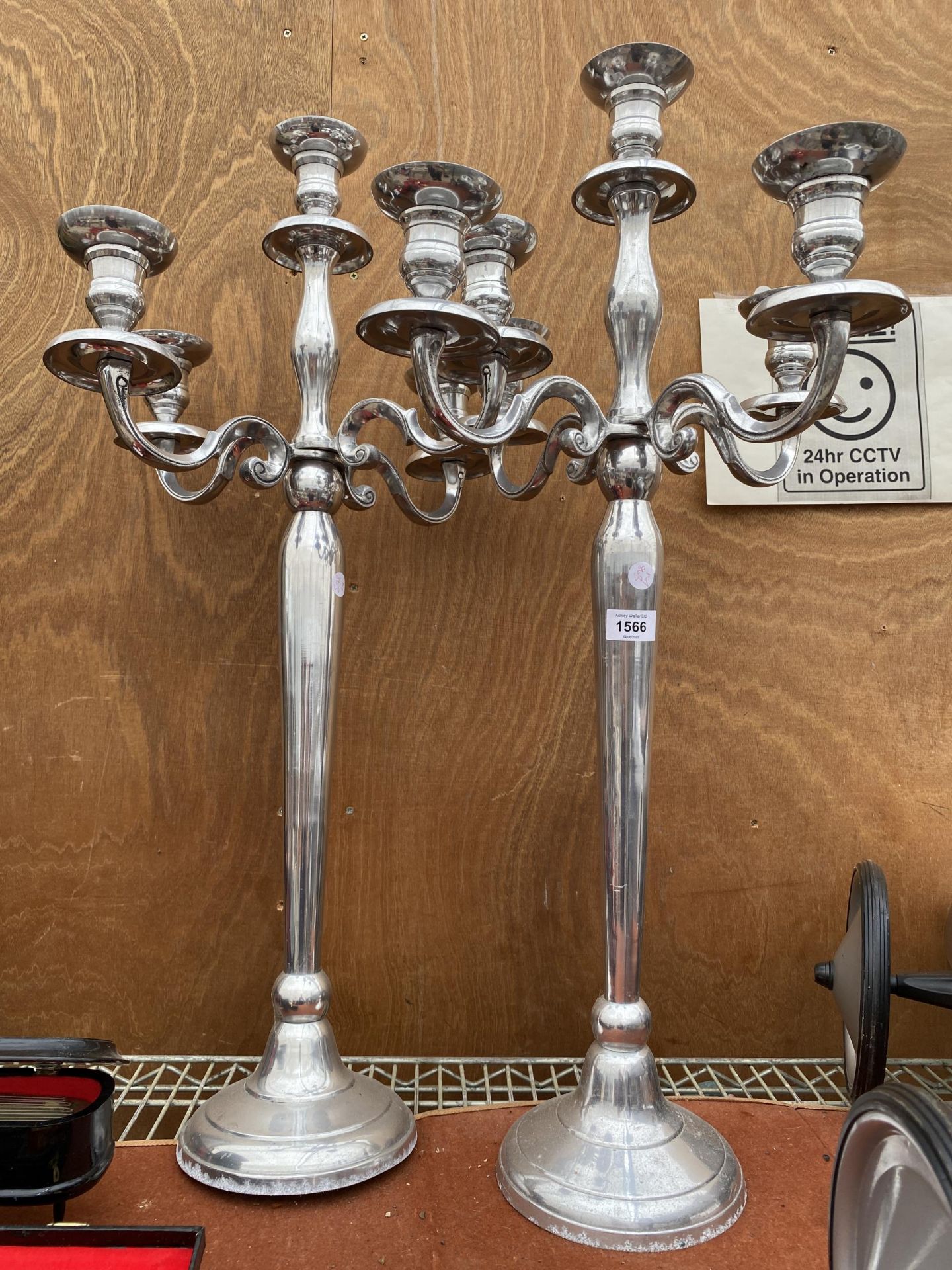 A PAIR OF FOUR BRANCH METAL CANDLESTICKS