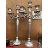 A PAIR OF FOUR BRANCH METAL CANDLESTICKS