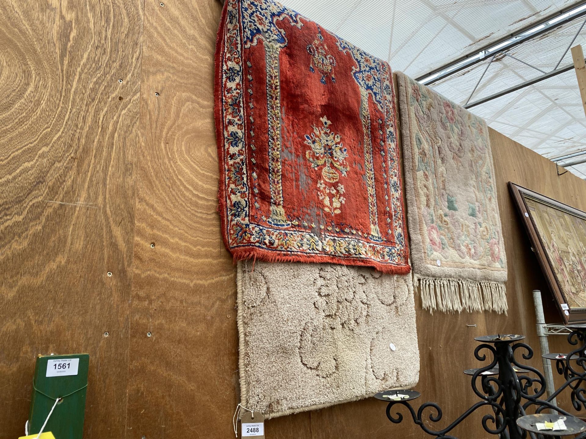 THREE SMALL PATTERNED RUGS