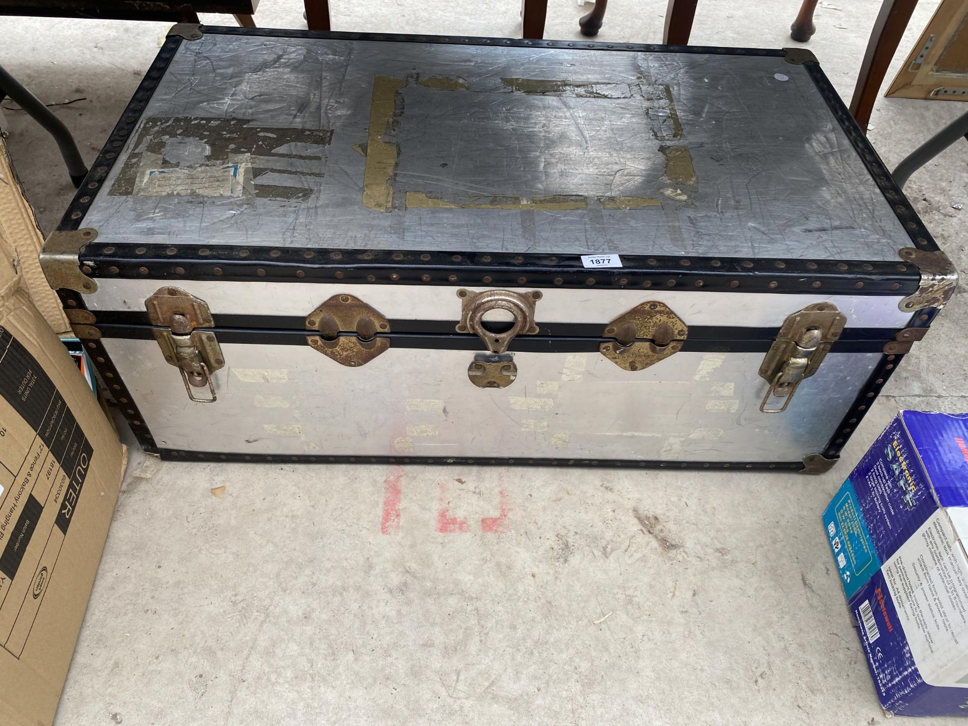A LARGE HARD CASED TRAVEL TRUNK