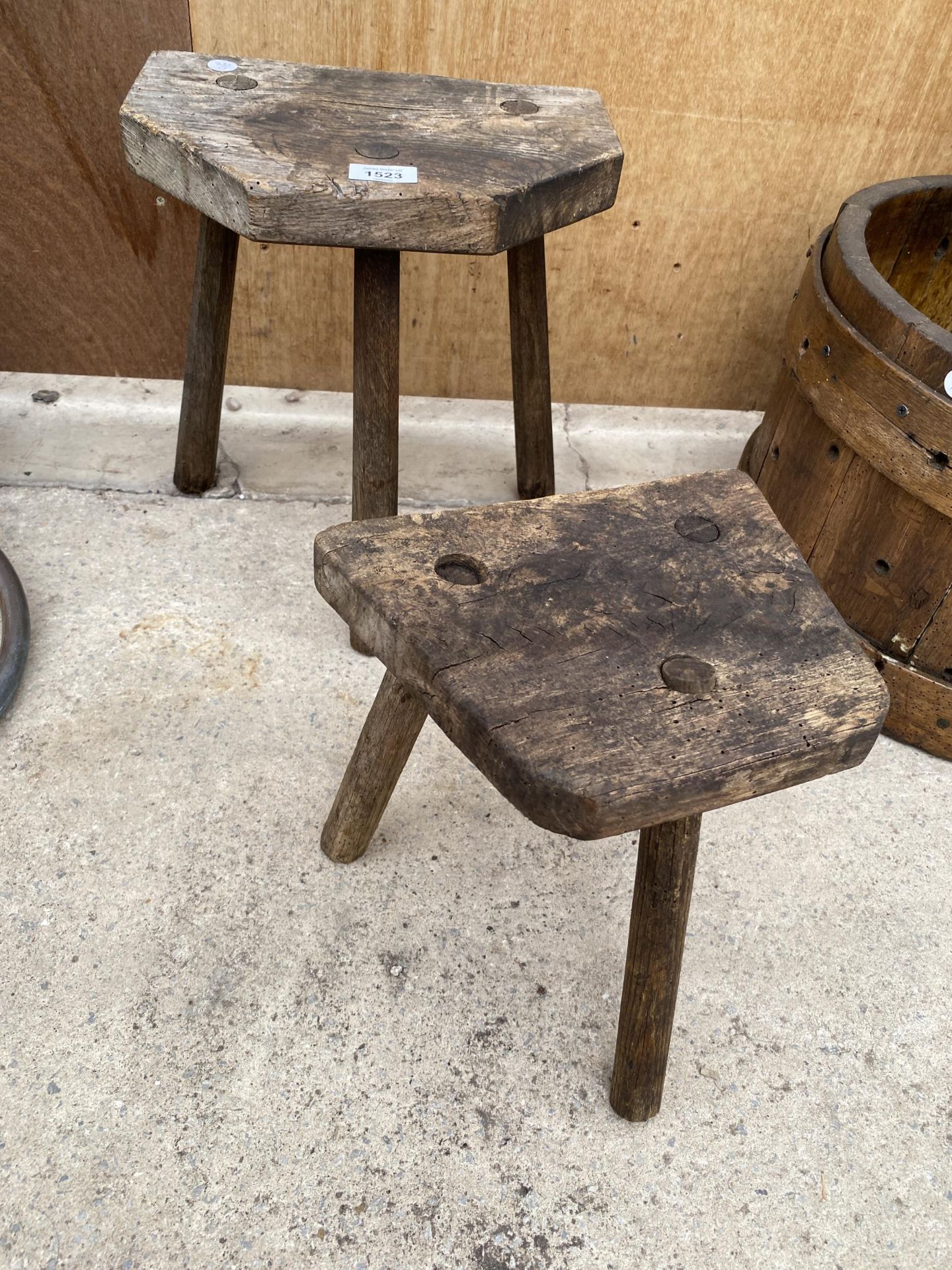 TWO VINTAGE WOODEN THREE LEGGED MILKING STOOLS