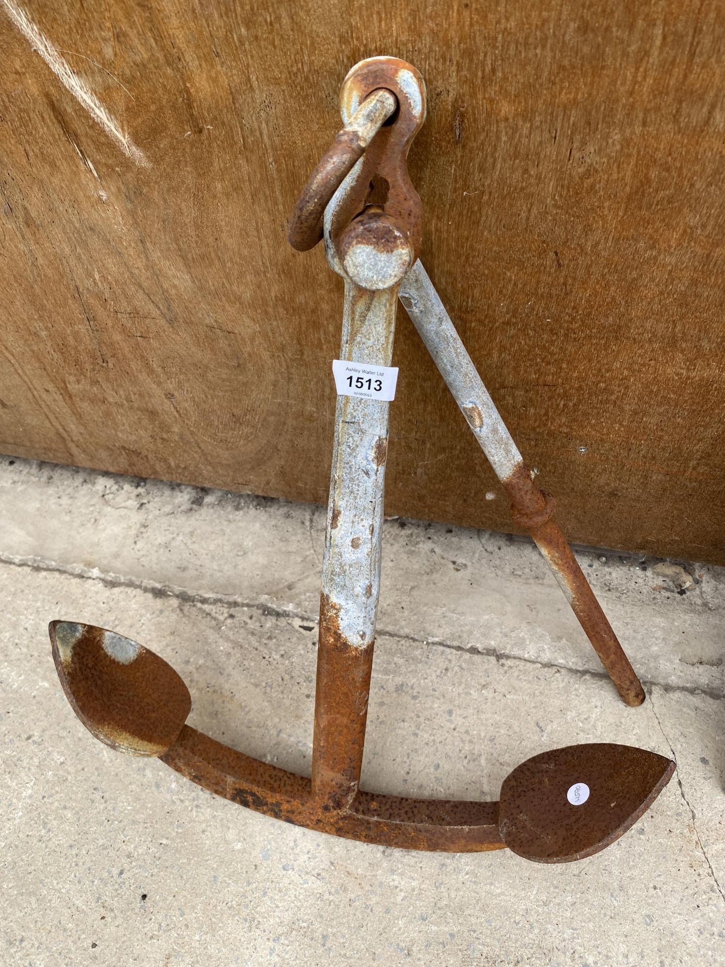 A VINTAGE METAL BOAT ANCHOR