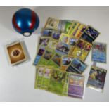 A POKE BALL TIN OF POKEMON TRADING CARDS, HOLOS, PIKACHU GX, SEALED ENERGY PACK ETC