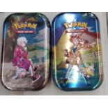 TWO TINS OF POKEMON CARDS TO INCLUDE SHINIES, ETC - 100+