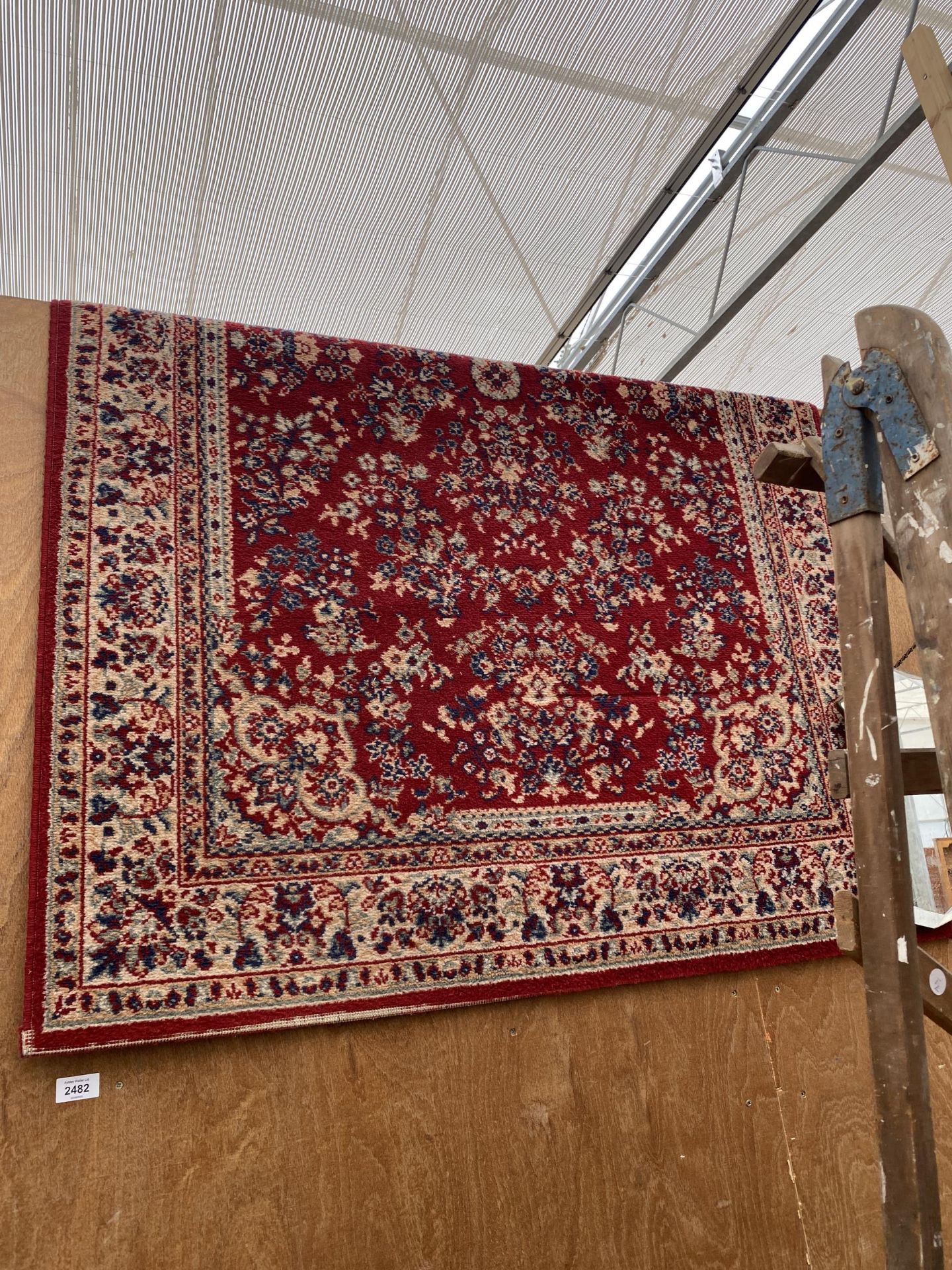 A RED PATTERNED RUG