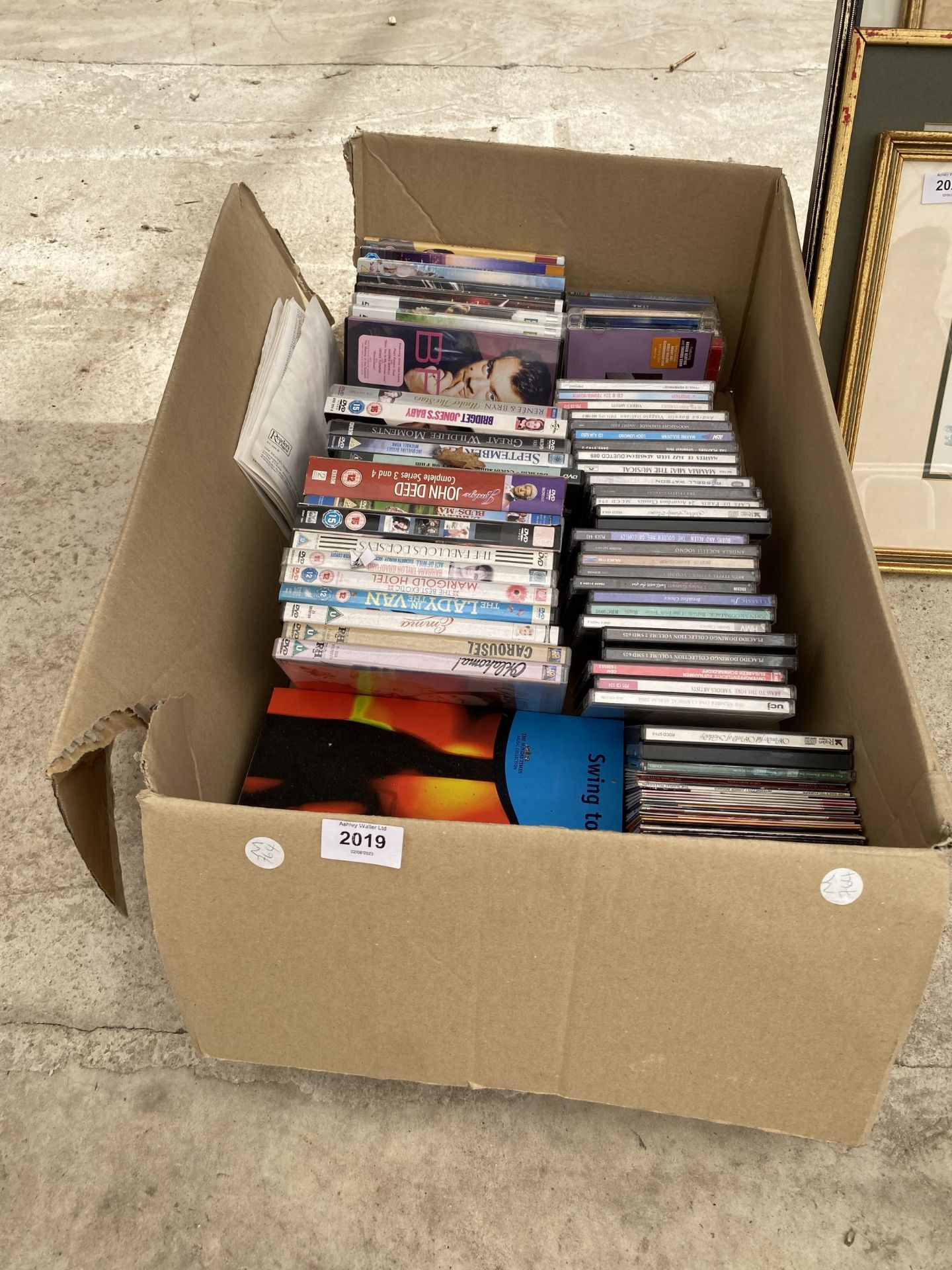 AN ASSORTMENT OF CDS AND DVDS