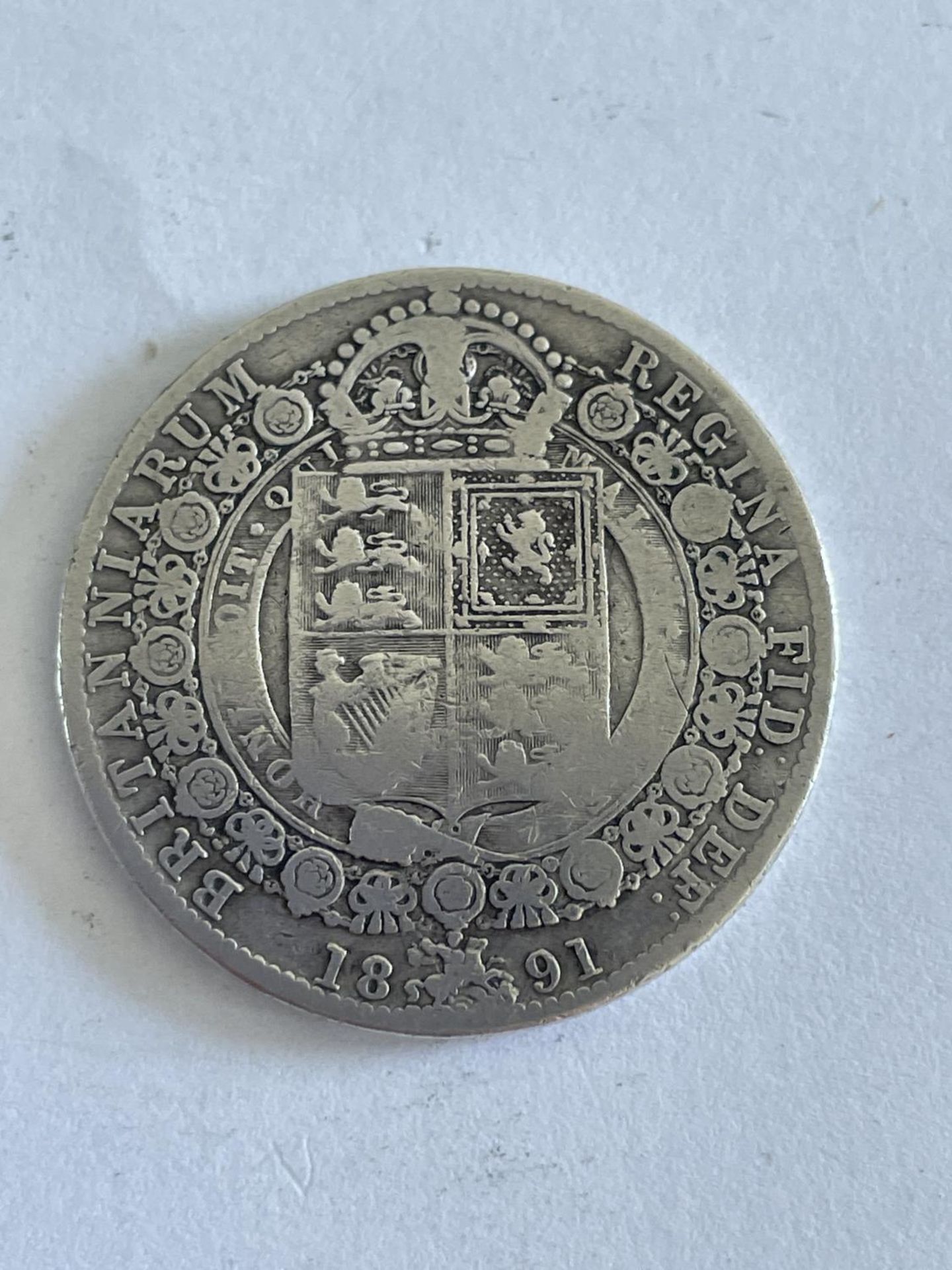 A VICTORIAN SILVER HALF CROWN 1891