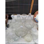 AN ASSORTMENT OF CUT GLASS ITEMS TO INCLUDE DECANTERS AND BOWLS ETC