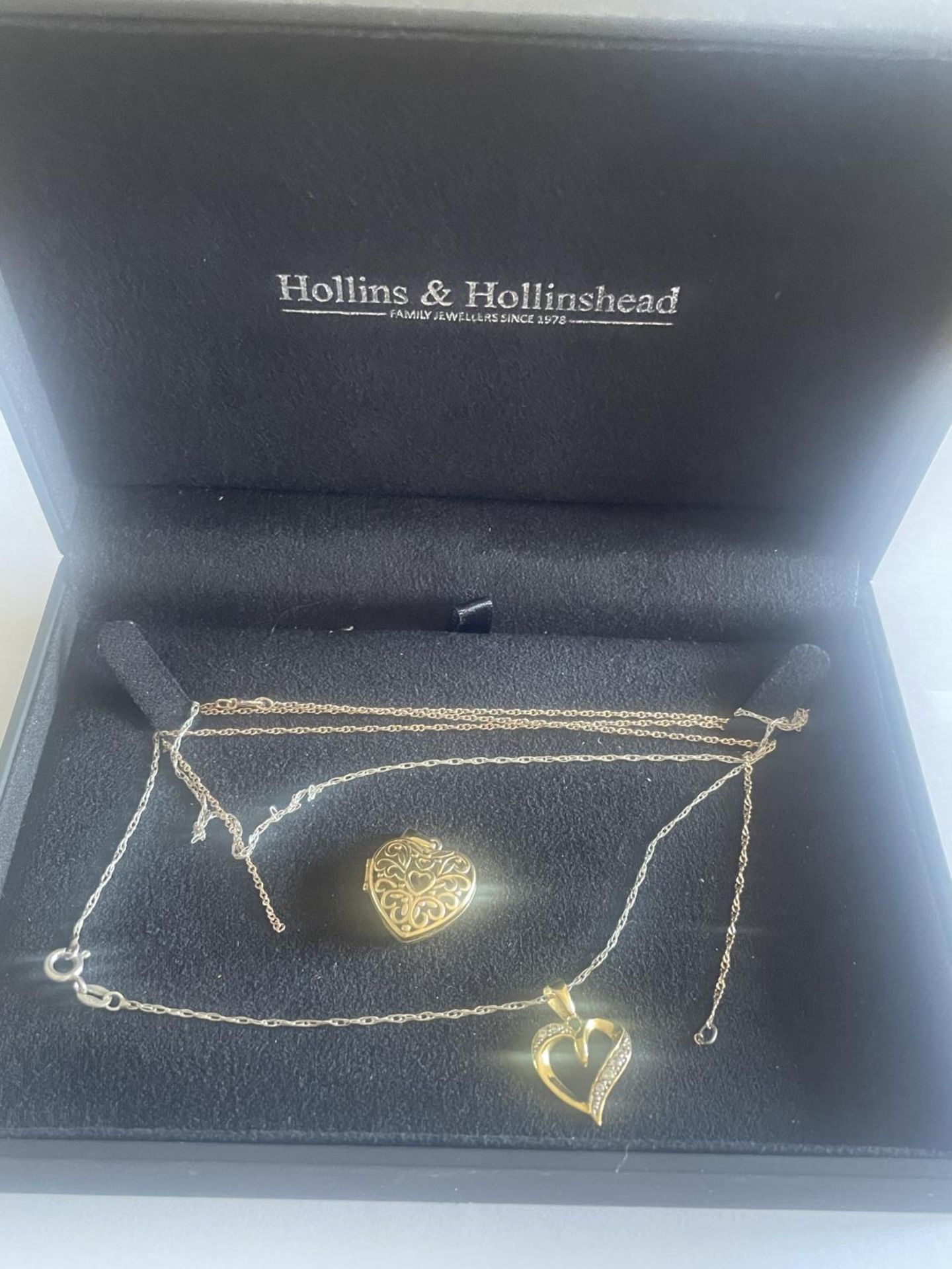 TWO SILVER GILT NECKLACES WITH HEART PENDANTS IN A PRESENTATION BOX