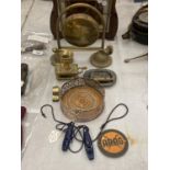 A QUANTITY OF ITEMS TO INCLUDE A BRASS GONG, CANDLESTICK AND MATCHBOX HOLDER, WINE BOTTLE COASTER,