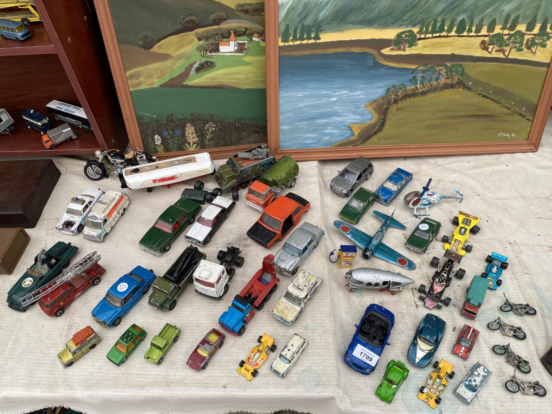A LARGE ASSORTMENT OF VINTAGE DIE CAST VEHICLES AND PLANES ETC