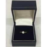 AN 18CT GOLD RING WITH SOLITAIRE - SIZE L