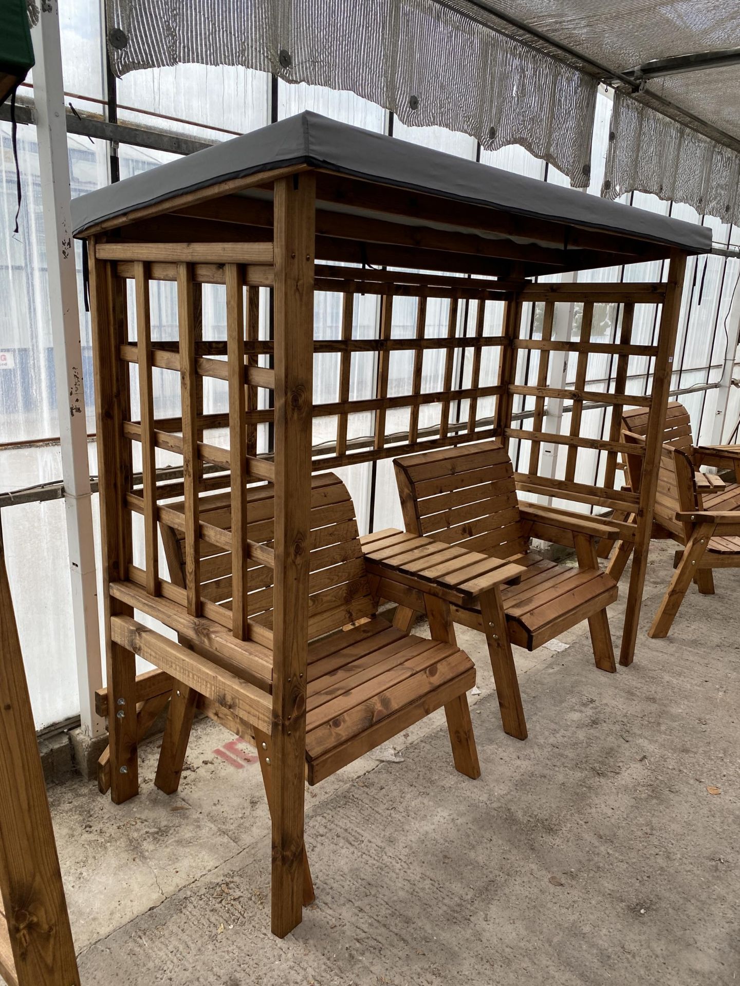 AN AS NEW EX DISPLAY CHARLES TAYLOR GARDEN ARBOUR WITH TWO SEATS AND AN ARMREST TABLE *PLEASE NOTE - Image 2 of 3