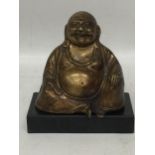 A BRONZE EFFECT MODEL OF A BUDDHA ON MARBLE BASE