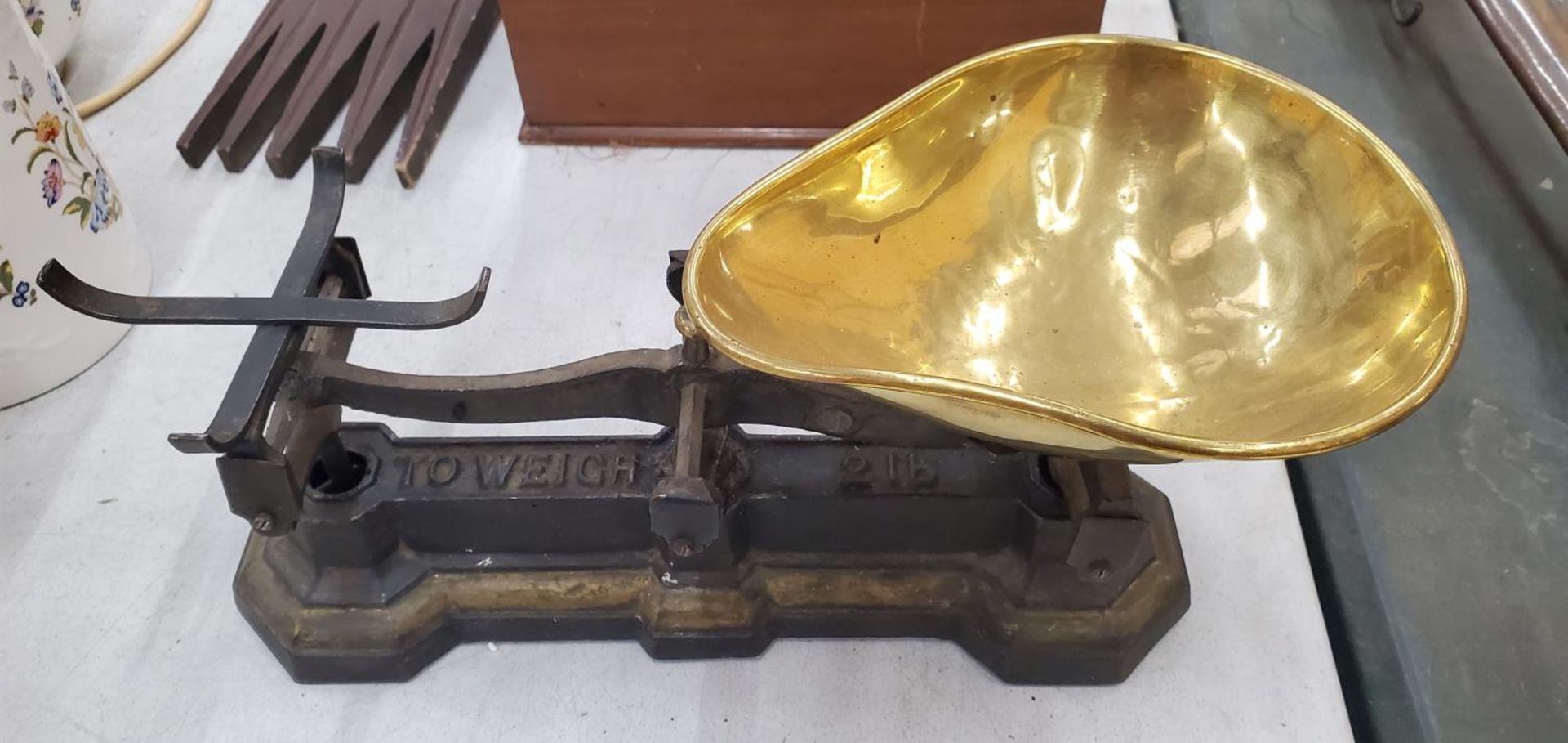 A SET OF VINTAGE CAST AND BRASS SCALES