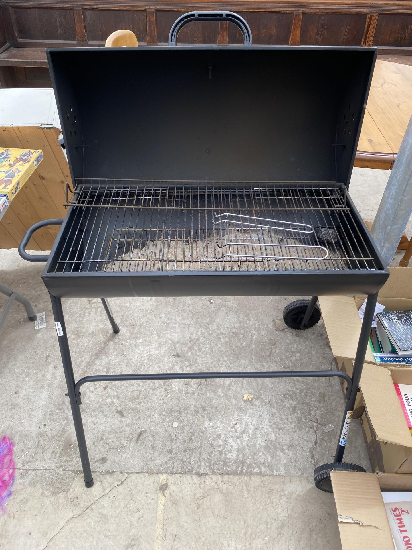 A CHARCOAL BBQ WITH STAND