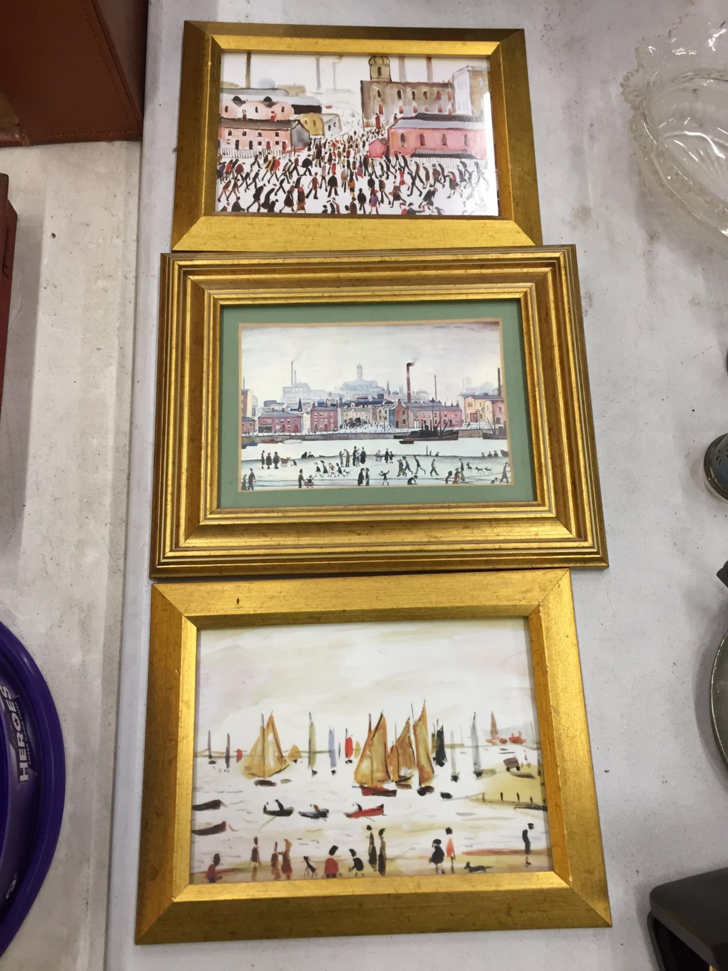 THREE GILT FRAMED L. S LOWERY PRINTS