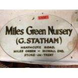 A GLASS OVAL SIGN WITH GOLD COLOURED WRITING 'MILES GREEN NURSERY' DIAMETER 56CM