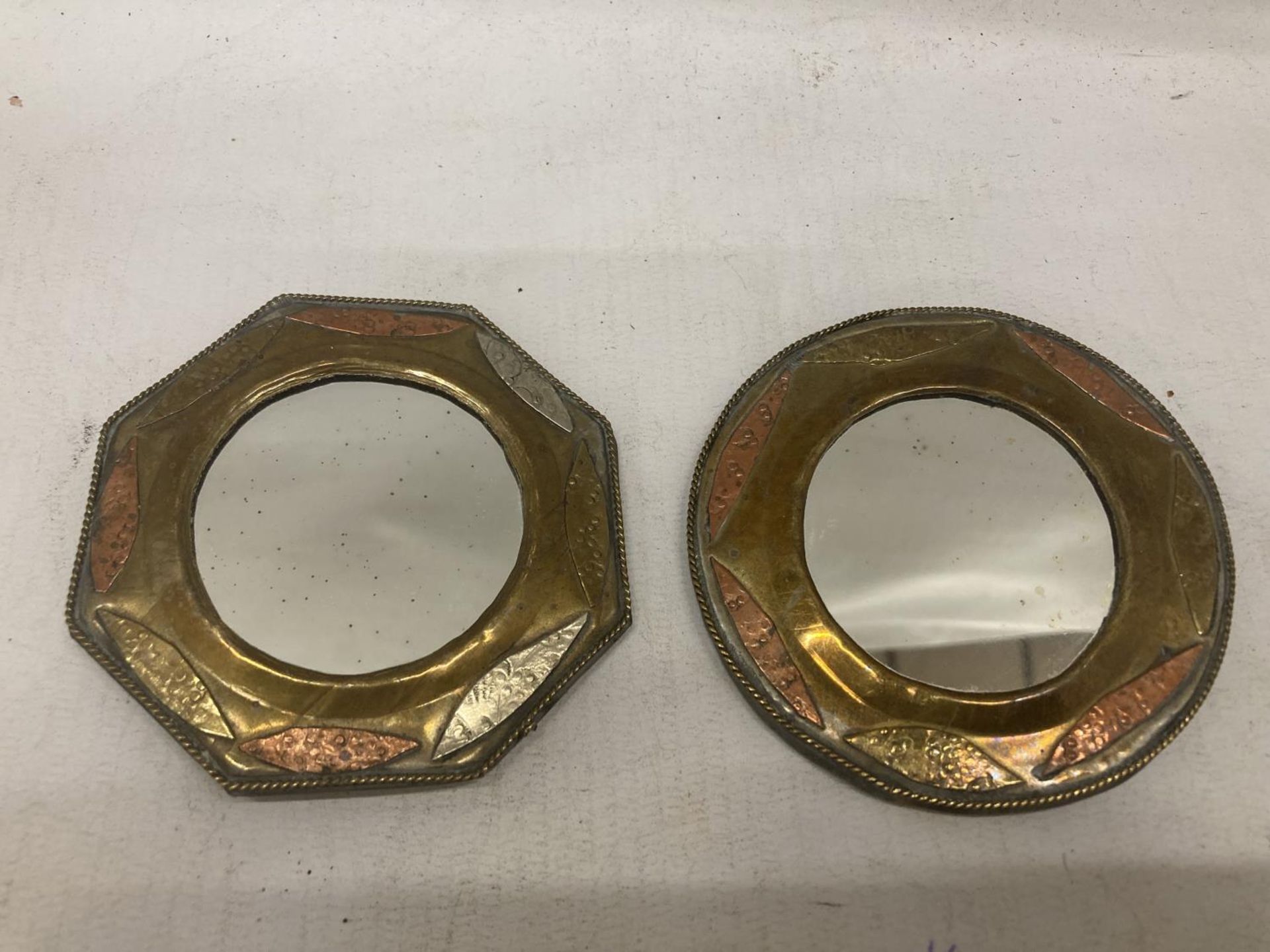 TWO SMALL BRASS AND COPPER MIRRORS DIAMETER 8.5CM