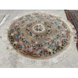 A CIRCULAR PEACH PATTERNED FRINGED RUG