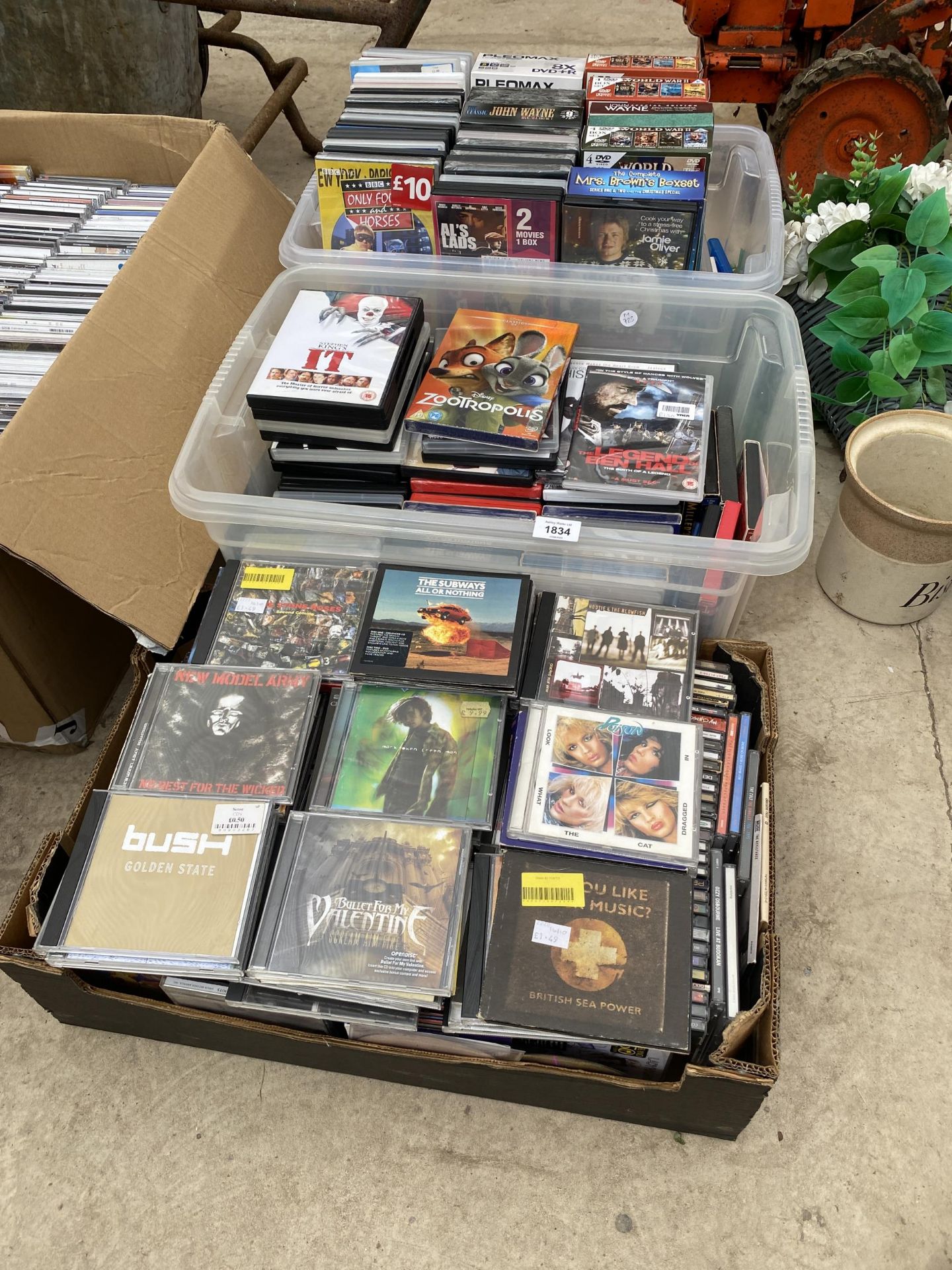 A LARGE ASSORTMENT OF CDS AND DVDS TO INCLUDE SEVERAL BOXSETS