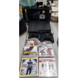 A PS3 GAMES CONSOLE WITH 2 CONTROLLERS AND SIX GAMES TO INCLUDE GRAN TURISMO 5 CALL OF DUTY,