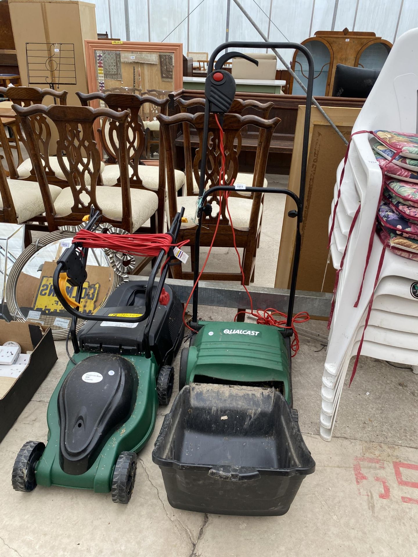 AN ELECTRIC QUALCAST LAWN RAKE AND AN ELECTRIC LAWN MOWER