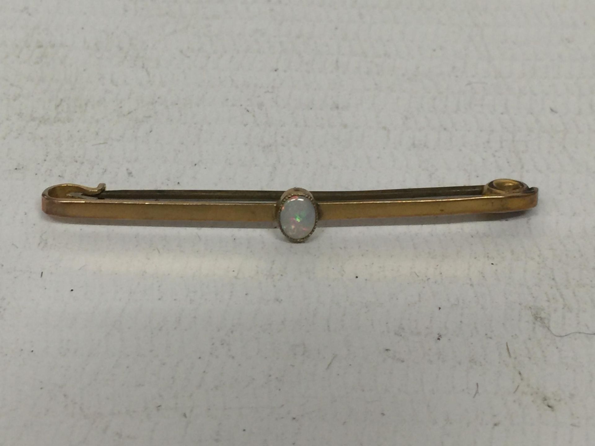 AN OPAL 9CT BAR BROOCH