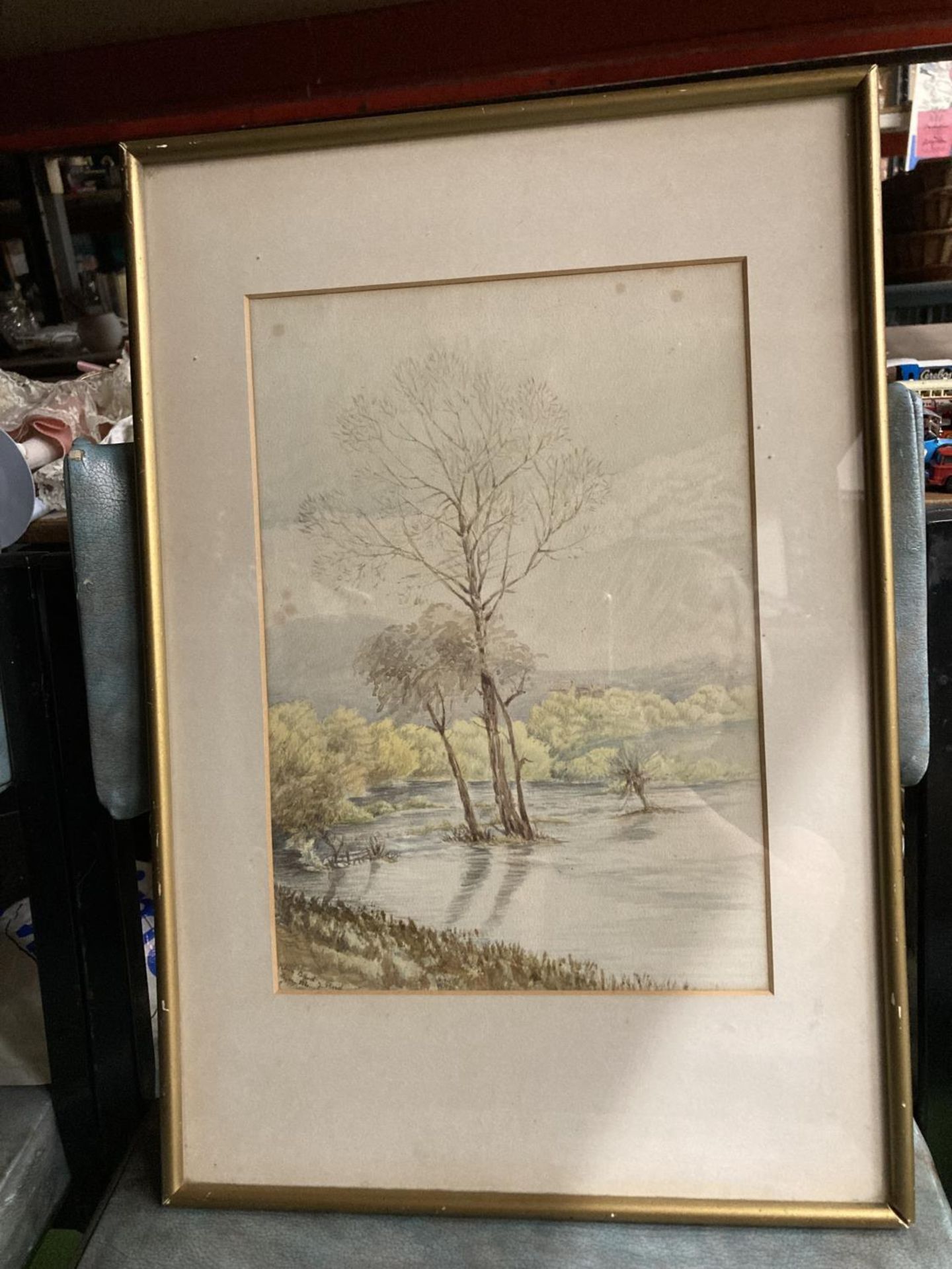 A SIGNED WATERCOLOUR OF THE FLOODED PASTURES