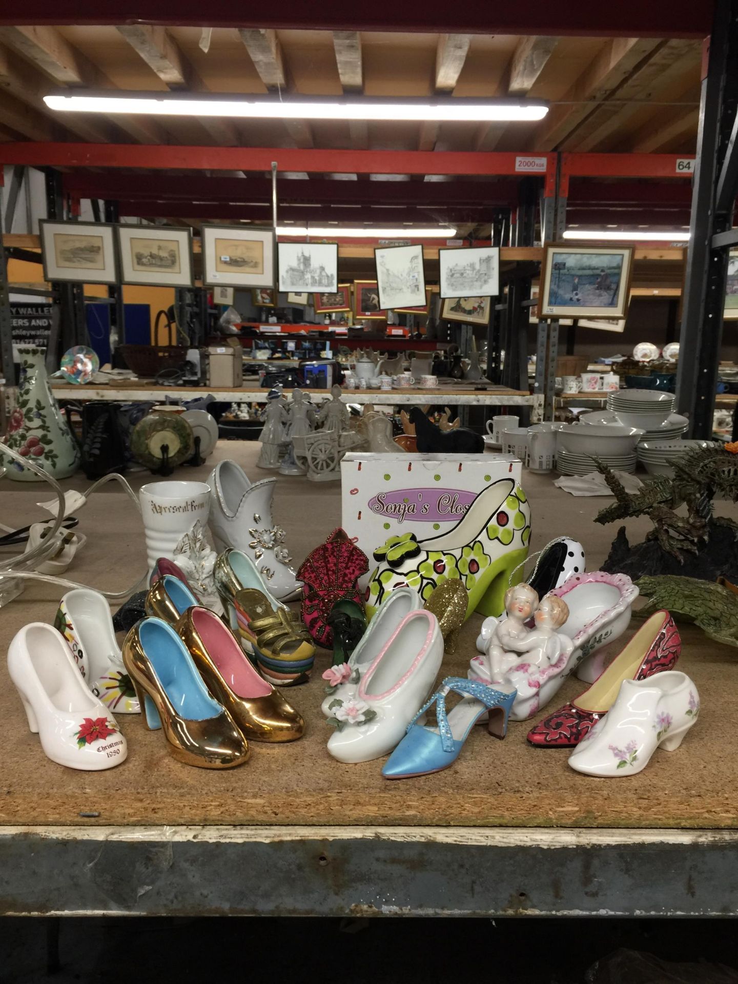 A GROUP OF CERAMIC SHOES ETC