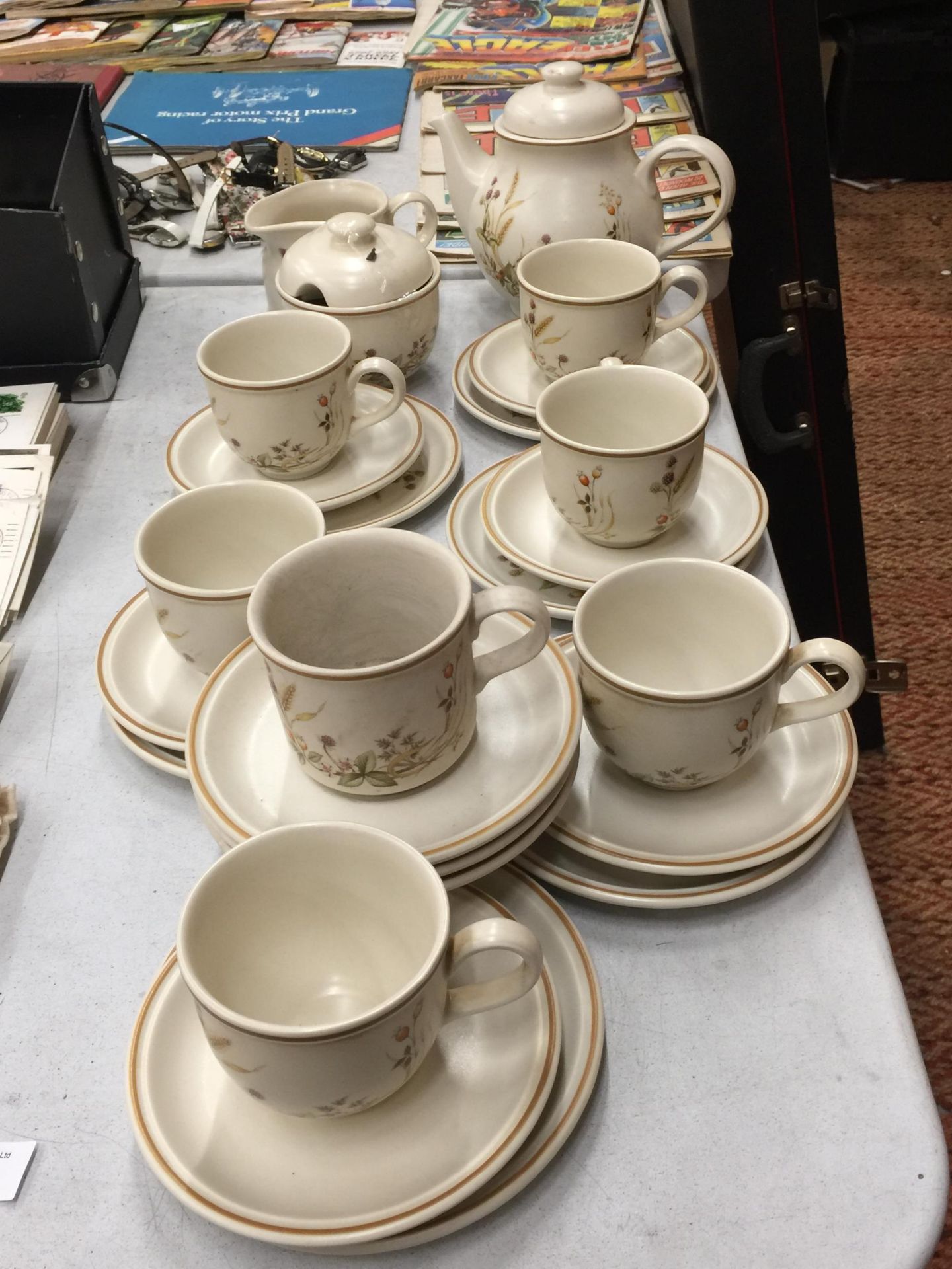 A 'HARVEST TIME' POTTERY TEASET TO INCLUDE A TEAPOT, CREAM JUG, SUGAR BOWL, CUPS, SAUCERS AND SIDE